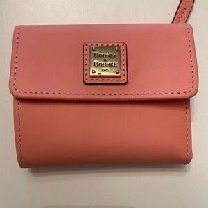 Brand new Dooney and Bourke small flap wallet in Light Pink